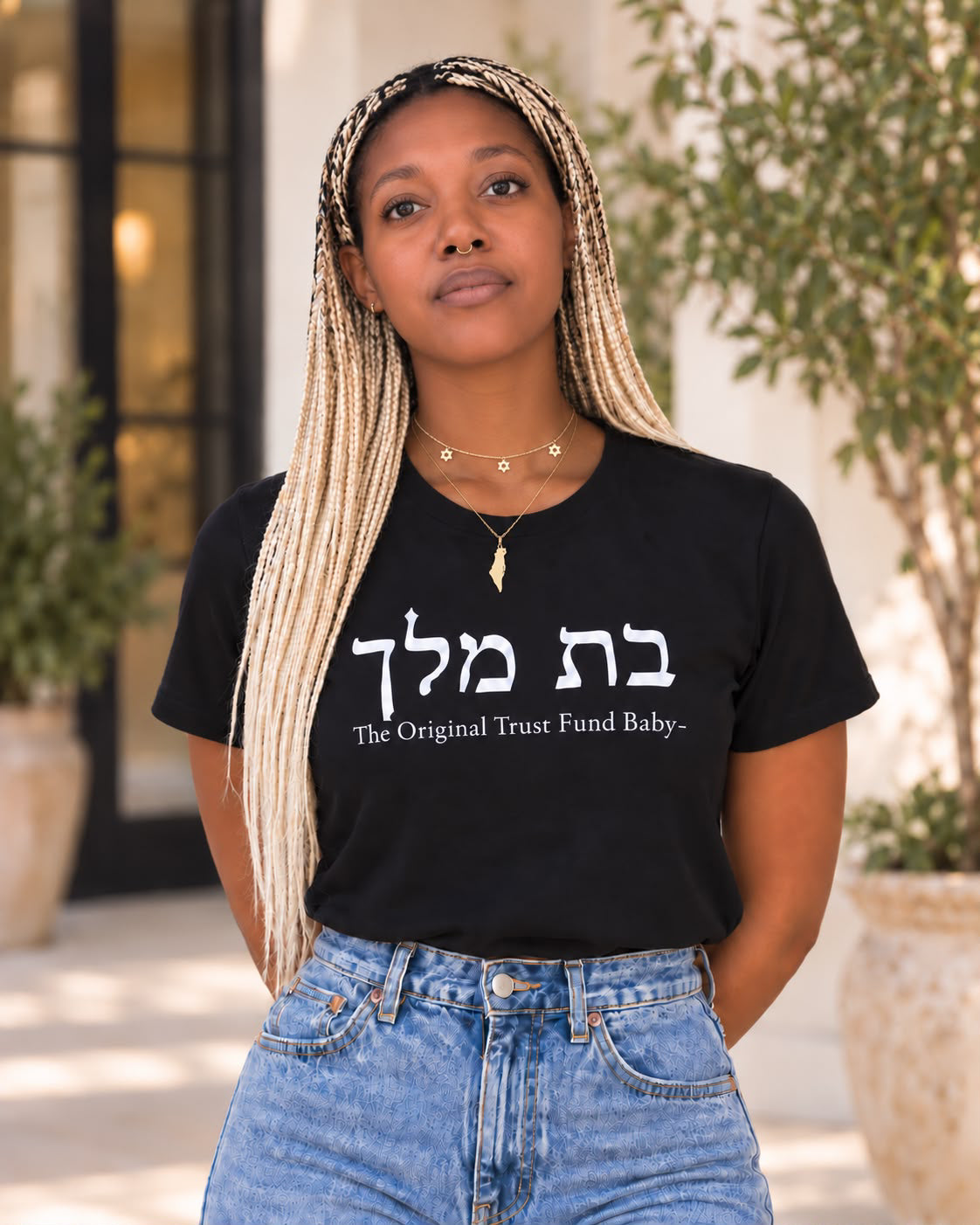 Daniella Kennedy wearing The Original Tee in black with Hebrew Bat Melech lettering and The Original Trust Fund Baby design by Hashem Is My Sugar Daddy.